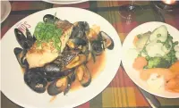  ??  ?? Left, Barbara’s salmon – plus mussels and lots of veg. Right, the fishcakes made for a nice starter
