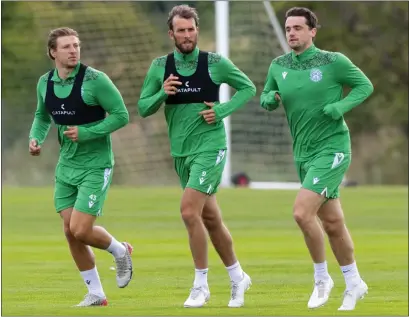  ??  ?? Christian Doidge (centre) back in training after weeks of fetching Melker Hallberg’s shopping during lockdown