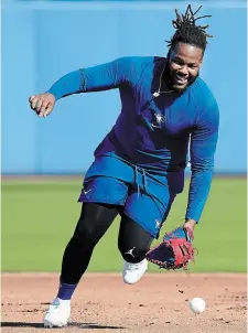 ?? NATHAN DENETTE THE CANADIAN PRESS ?? Toronto Blue Jays first baseman Vladimir Guerrero Jr. catches a ground ball during a drill at spring training in Dunedin, Fla., on Monday, as select players reported to camp early.