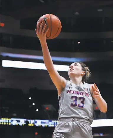  ?? Jessica Hill / Associated Press ?? UConn’s Katie Lou Samuelson elevates for a layup against Memphis on Wednesday night at the XL Center in Hartford. Samuelson finished with a season-high 32 points, 10 rebounds and seven assists in a 102-45 win.