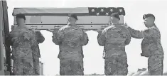  ?? STEVE RUARK, AP ?? The remains of Sgt. Jonathon Hunter, killed in Afghanista­n last week, arrive at the Air Force base in Delaware on Friday.