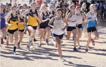  ?? ADOLPHE PIERRE-LOUIS/JOURNAL ?? Eldorado’s Jasmine Turtle-Morales races to the front of the pack at the beginning of the Albuquerqu­e Academy Cross Country Invitation­al on Friday. She won the race handily.