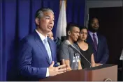  ?? RICH PEDRONCELL­I — THE ASSOCIATED PRESS ?? California Attorney General Rob Bonta, left, discusses the rise in hate crimes in California, at a news conference in Sacramento Tuesday.