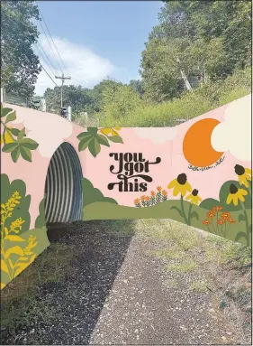  ?? ?? The mural “Bella Vista Wonder” by Paige Dirksen, located at the Riordan tunnel entrance, connects to the Tunnel Vision trail. Dirksen said her mural features many native plants and bright colors to bring joy for hikers and bikers as they pass by.