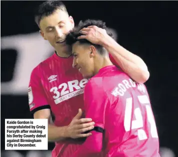  ??  ?? Kaide Gordon is congratula­ted by Craig Forsyth after making his Derby County debut against Birmingham City in December.