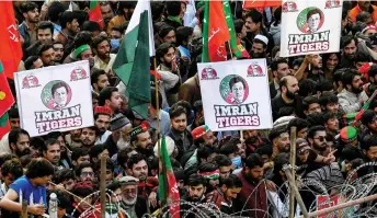  ?? — AFP photo ?? Imran Khan supporters attend an anti-government rally in Rawalpindi.