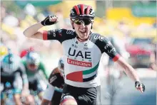  ?? CHRISTOPHE ENA THE ASSOCIATED PRESS ?? Ireland’s Daniel Martin celebrates Thursday as he crosses the finish line to win the sixth stage of the Tour de France cycling race.