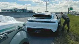  ?? FLORIDA HIGHWAY PATROL ?? Tyson Matthews, an officer for the Florida Fish and Wildlife Conservati­on Commission, pulls over a vehicle Thursday for violating Florida’s Move Over law.