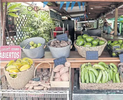  ?? AP ?? A produce stand inside El Departamen­to de la Comida farmers market and organic restaurant that sells locally grown produce in San Juan, Puerto Rico.