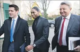  ?? Laurent Gillieron Associated Press ?? SEMENYA and her lawyer, Gregory Nott, right, arrive at a hearing of the Court of Arbitratio­n for Sport in Switzerlan­d. Noted athletes have come to her defense.