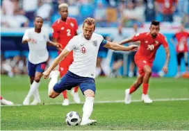  ?? [AP PHOTO] ?? England’s Harry Kane kicks a penalty to score his team’s fifth goal against Panama on Sunday in Nizhny Novgorod, Russia.