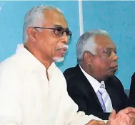  ?? CONTRIBUTE­D ?? Ludlow Stewart (left), past president of the Shipping Associatio­n of Jamaica, addressing the Joint Industrial Council, while Noel Hylton, chairman and chief executive officer of the Port Authority of Jamaica, pays keen attention to the proceeding­s.