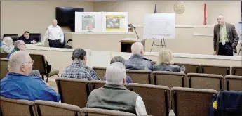  ?? Keith Bryant/The Weekly Vista ?? Bella Vista fire chief Steve Sims (left, background) fields questions alongside police chief James Graves during a town hall session last Wednesday, Feb. 5, focused on a municipal bond issue that will be going to voters during the March 3 primary election.