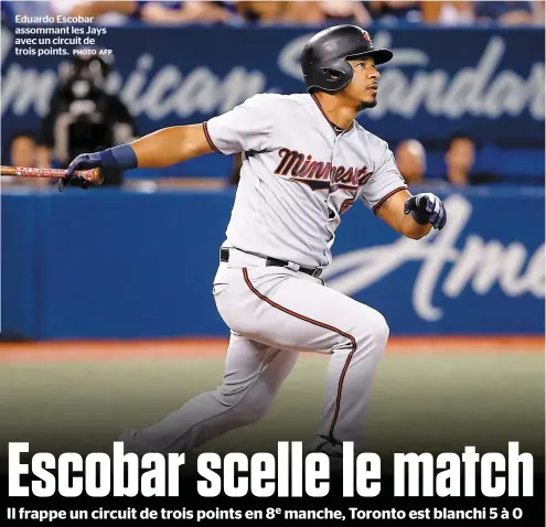  ?? PHOTO AFP ?? Eduardo Escobar assommant les Jays avec un circuit de trois points.