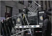  ?? SETH WENIG — THE ASSOCIATED PRESS ?? Barricades are unloaded from a truck near the courts in New York, March 20, 2023.