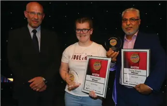  ??  ?? Young Award joint winners Kelsi McFadden and Raza Sadiq (collecting on behalf of Abdul Haseeb) with Phil Goodman, of the Glasgow Fort