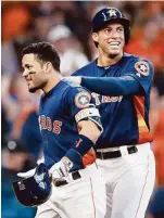  ?? Melissa Phillip / Houston Chronicle ?? Jose Altuve receives a warm greeting from George Springer after hitting a two-run homer in the second inning Sunday.