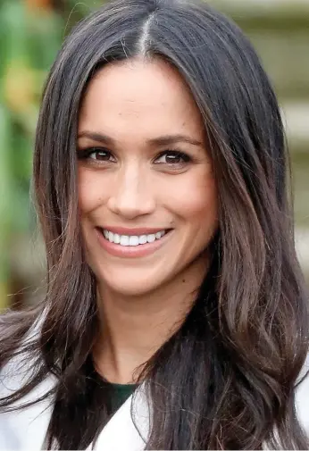  ??  ?? Looks familiar: Meghan, left, and Pippa share identical colour hair parted in the centre, sparkling brown eyes and those shining white winning smiles