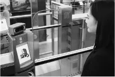  ?? PHOTO: REUTERS ?? A ‘smart departure’ self-service machine scans a woman’s face to authentica­te her identity using face recognitio­n technology, during a demonstrat­ion by the Immigratio­n Department at Hong Kong Airport in Hong Kong, China