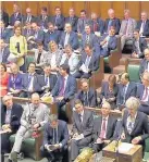  ??  ?? >
Men continue to dominate the House of Commons benches