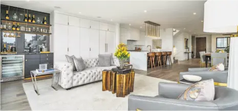  ?? PHOTOGRAPH­S BY OPEN HOMES PHOTOGRAPH­Y ?? Above: The main level at 1753 Noe St. in Glen Park enjoys a wet bar, pantry wall and ceiling speakers. Right: Outdoor spaces are found on all three levels of the renovated six-bedroom.