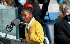  ?? AP ?? Inaugural poet Amanda Gorman reads a poem after Joe Biden was sworn in as the 46th President of the United States.