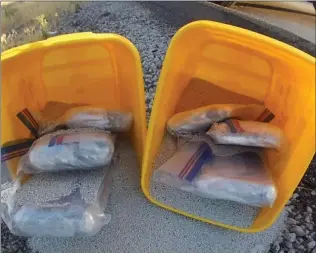  ?? Courtesy photo ?? Santa Clarita Valley Sheriff’s Station’s Domestic Highway Enforcemen­t Team seize bags of marijuana that was hidden in buckets of kitty litter.
