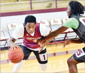  ?? WILLIAM HARVEY/RIVER VALLEY & OZARK EDITION ?? Morrilton senior Donad Jones drives on junior teammate Jordan Walls.