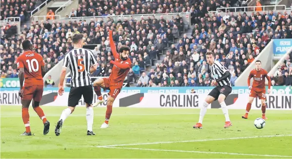  ?? — Reuters photo ?? Liverpool’s Mohamed Salah scores their second goal.