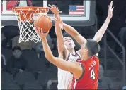  ?? ROSS D. FRANKLIN — THE ASSOCIATED PRESS ?? Texas Tech forward Daniel Batcho goes up for a shot against Gonzaga center Chet Holmgren on Saturday.