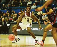  ?? Tyler Sizemore / Hearst Connecticu­t Media ?? UConn guard Nahiem Alleyne (4) controls the ball against Delaware State on Sunday.