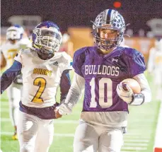  ?? APRIL GAMIZ/THE MORNING CALL PHOTOS ?? Northern Lehigh’s Trevor Amorim (10) makes a touchdown against West Catholic’s Zymeen Howell (2) on Friday at Whitehall High School.