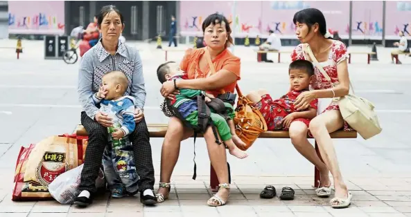  ??  ?? Even with the reversal of China’s one-child policy, women are not keen to have more children as it’s challengin­g to balance work and family life.
