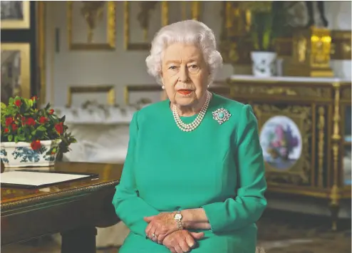  ?? BUCKINGHAM PALACE / AFP via Gett
y Imag
es ?? In a rare broadcast on Sunday, Queen Elizabeth told the British people that they would overcome
the coronaviru­s crisis if they stayed resolute in the face of lockdown and self-isolation.