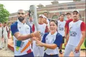  ?? SANCHIT KHANNA/HT ?? PR Sreejesh and MC Mary during the torch relay.