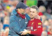  ?? REUTERS ?? Liverpool skipper Jordan Henderson, who scored the second goal versus Southampto­n, is greeted by manager Jurgen Klopp.