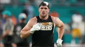  ?? Eric Espada / Getty Images ?? Steelers pass rusher T.J. Watt warms up before the game Sunday against the Miami Dolphins at Hard Rock Stadium in Miami Gardens, Fla.