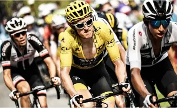  ?? — AFP photo ?? Thomas (centre), wearing the overall leader’s yellow jersey, rides during the 17th stage of the 105th edition of the Tour de France cycling race, between Bagneres-de-Luchon and Saint-Lary-Soulan Col du Portet, southweste­rn France.