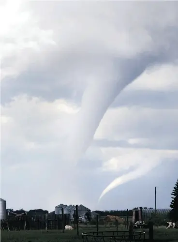  ?? ANDREW SPEARIN / POSTMEDIA NEWS FILES ?? Funnel clouds form near Asquith, west of Saskatoon. Extreme weather events are among the disasters that can befall a farm and instantly wipe out investment­s.