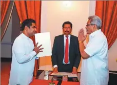  ?? SRI LANKAN PRESIDENT'S OFFICE VIA AP ?? Sri Lanka’s President Gotabaya Rajapaksa (right) greets Kanchana Wijesekera after the latter took the oath of office as the Power and Energy Minister in Colombo on Saturday.