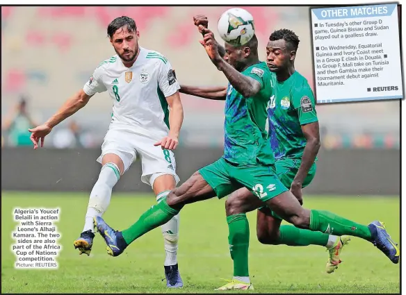  ?? Picture: REUTERS ?? Algeria’s Youcef Belaili in action with Sierra Leone’s Alhaji Kamara. The two sides are also part of the Africa Cup of Nations competitio­n.
D In Tuesday’s other Group and Sudan game, Guinea Bissau draw. played out a goalless On Wednesday, Equatorial meet Guinea and Ivory Coast Douala. in a Group E clash in on Tunisia In Group F, Mali take their and then Gambia make tournament debut against Mauritania.