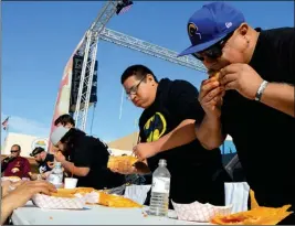  ??  ?? A popular attraction of the Somerton Tamale Festival is the tamale eating contest. The competitio­n takes place again as part of Saturday’s festival.