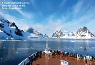  ?? ?? A cruise ship takes tourists along the coasts of the Antarctic peninsula