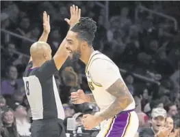  ?? Mark J. Terrill Associated Press ?? D’ANGELO RUSSELL is smiling a lot lately. Since returning to the starting lineup five games ago, he is averaging 27.2 points and making 54% of his threes.