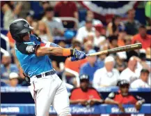  ?? LYNNE SLADKY / The Associated Press ?? Ronald Acuna takes a swing while playing for the World Team in the All-Star Futures Game in early July.