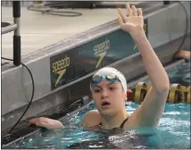  ?? KEN SWART — FOR MEDIANEWS GROUP ?? West Bloomfield’s Elizabeth Eichbrecht celebrates her 200-yard freestyle title (1:48.42) during the Division 1 swimming and diving finals held on Saturday at Oakland University. Eichbrecht also won the 500-yard freestyle in 4:52.71.