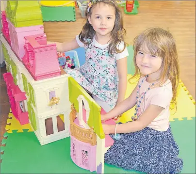  ?? SALLY COLE/THE GUARDIAN ?? Kristina Walsh, left, and Elena MacNevin have become great friends over the past year while attending drop-in play at St. Pius X Church in Charlottet­own. CHANCES operates the program, which closes for the summer on June 20, and will hopefully be back...