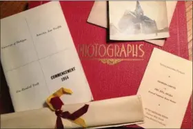  ?? MELISSA RAYWORTH VIA AP ?? If elderly family members struggle to remember faces in old photo albums, consider scanning those shots and printing them along with brief family stories in what memory researcher­s call “memory books.”