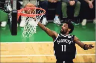  ?? Maddie Malhotra / TNS ?? Nets guard Kyrie Irving cannot participat­e with the team as long as he doesn’t comply with New York City’s COVID-19 vaccinatio­n mandate.