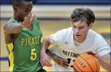  ?? KYLE FRANKO — TRENTONIAN PHOTO ?? Nottingham’s Joe Lemly, right, drives to the basket as West Windsor-Plainsboro South’s Bryson Amos-Whitfield, left, defends on Tuesday night at the Galaxy.